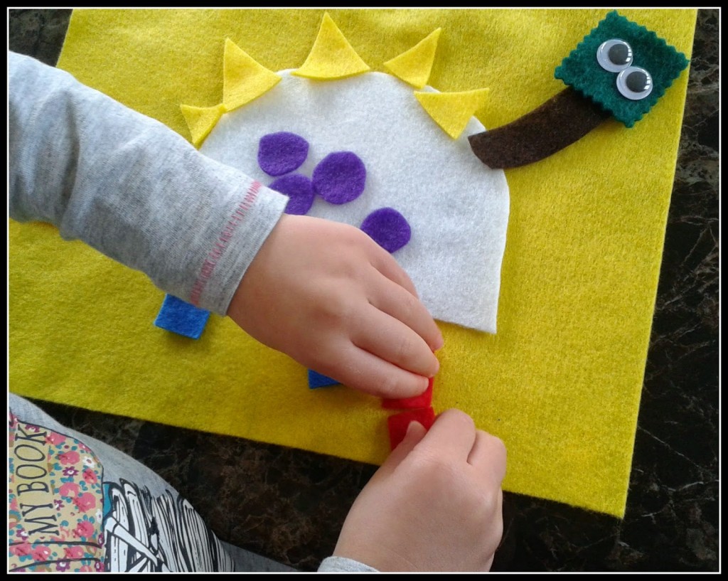 making a dinosaur shape collage with felt