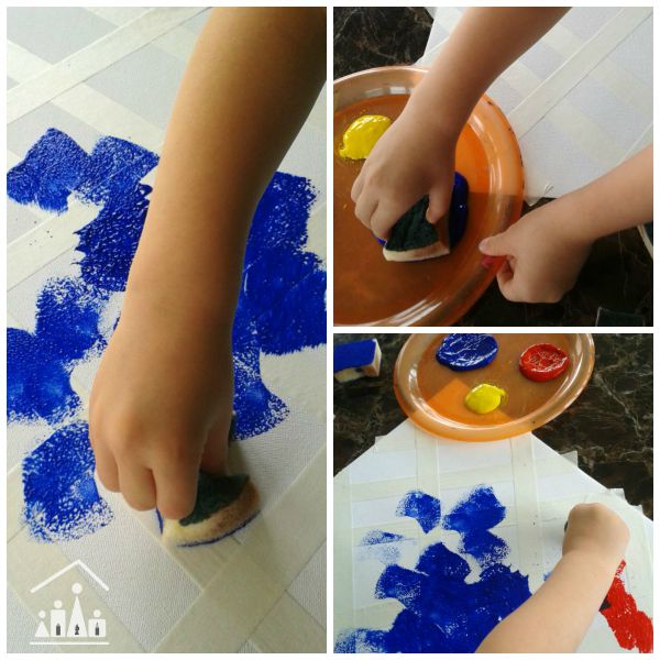 doing tape resisit sponge painting for preschoolers 