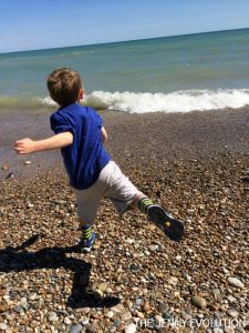 Outdoor Activities for Kids Throwing Rocks on the Beach