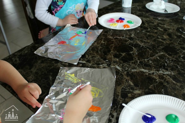 Kids doing tin foil painting 