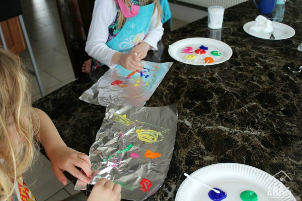Kids doing tin foil painting 