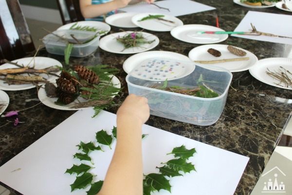 Kids making nature collages inside