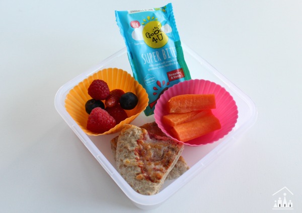 Healthy school lunch with pitta bread berries and carrot sticks