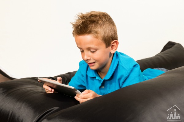 Child reading on a beanbag
