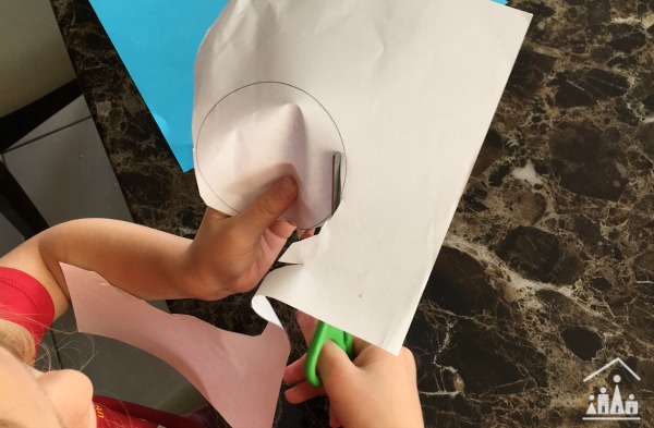 Child cutting out a circle