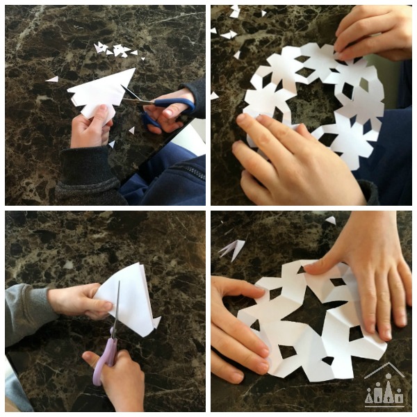 Kids cutting out snowflakes