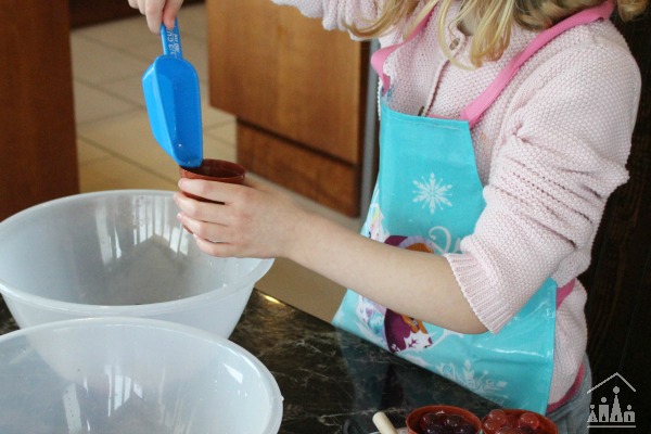 Child scooping waterbeads during a fine motor skills activity